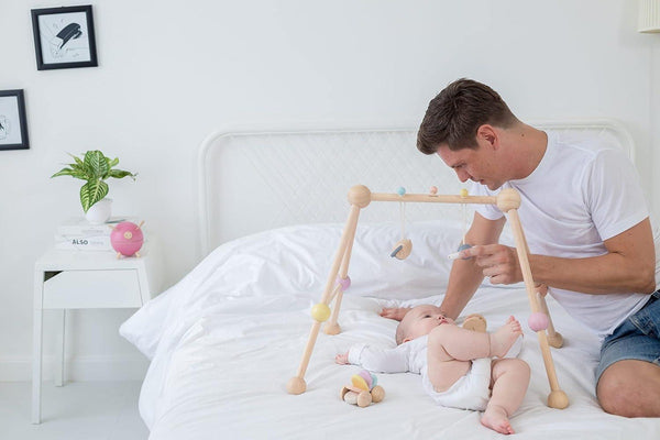 Wooden Baby Play Gym with 2 Detachable Toys Promotes Learning and Development