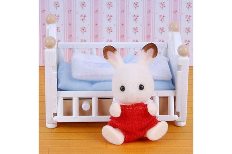 Sylvanian Families: Chocolate Rabbit Baby and Crib Bed Set.